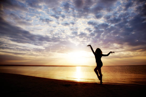 istock Woman exercising during sunset 1346953498