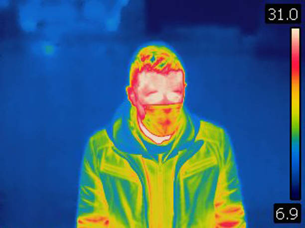 istock Thermal image of man wearing protective face mask 1346954547