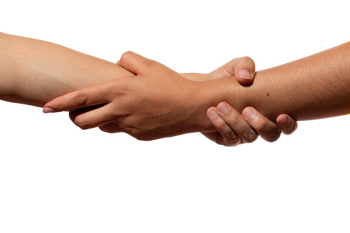 Two hands holding from the forearm, isolated on white background. Forearm salute. Concept of rescue, love, friendship, support, teamwork, partnership, partnership, humanity and brotherhood.
