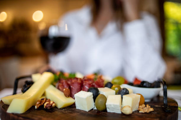 istock An elegant young woman having lunch in a cozy restaurant 1346956878