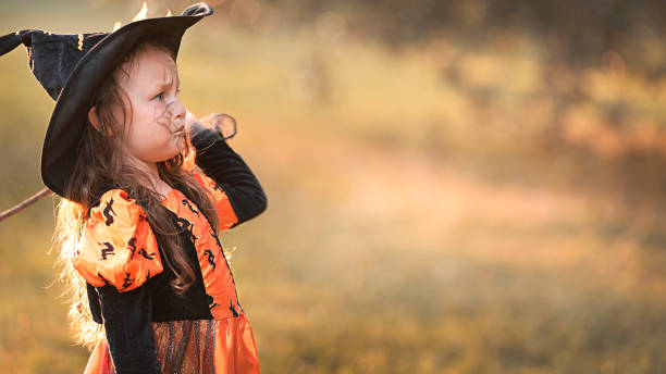 istock Little witch girl 1346957669