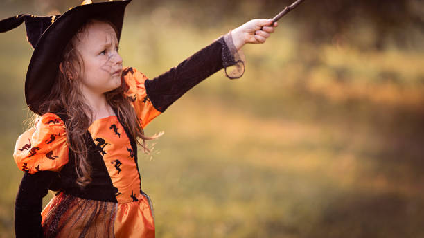 istock Little witch girl 1346957671
