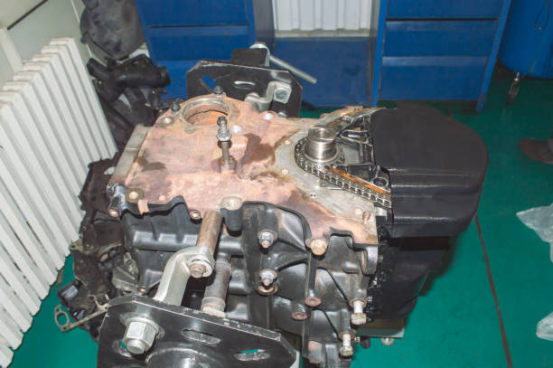 istock Top view of the front part of the partially disassembled engine, which is installed and rotated on the engine repair stand 1346957861