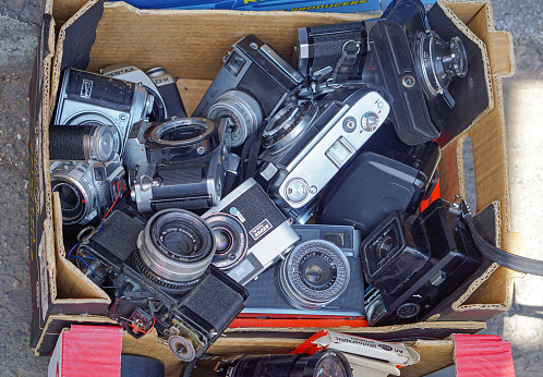 Athens, Greece - May 3, 2015: Many old retro vintage film cameras for sale at flea market.