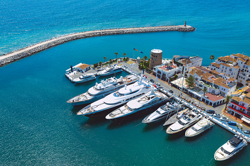 Aerial top view of luxury yachts in Puerto Banus marina, Marbella, Spain. 04.05.2021. High quality photo