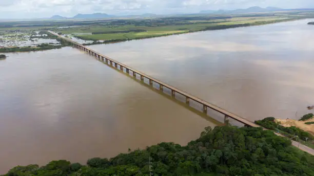 Aerial image with drone of the Rio Branco river and the bridge in the City of Boa Vista, Roraima, Brazil.