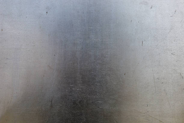 Rough scratched stainless steel surface. Textured background. Blank for design. Underlay or undercoat. Copy space