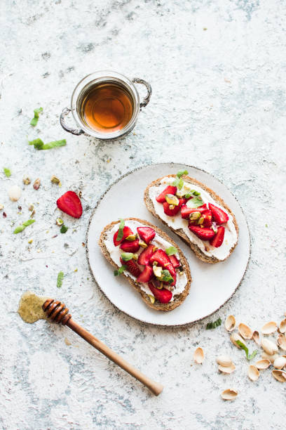 istock Sandwich with strawberries, soft cheese and honey 1346977023