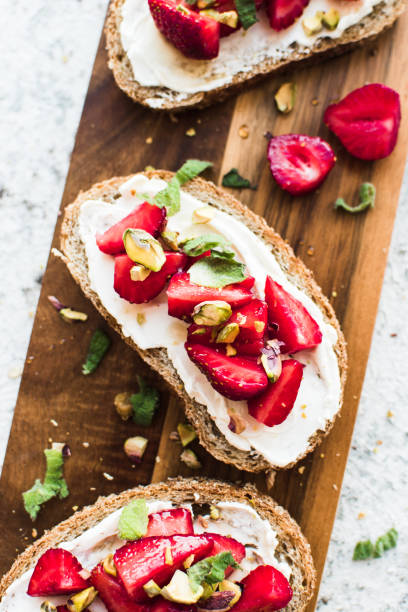 istock Sandwich with strawberries, soft cheese and honey 1346977027