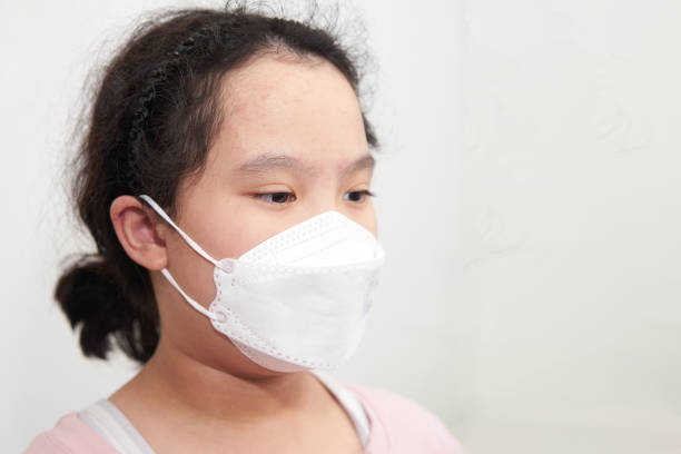 istock asia young girl wear protect mask think with copy space 1346987393