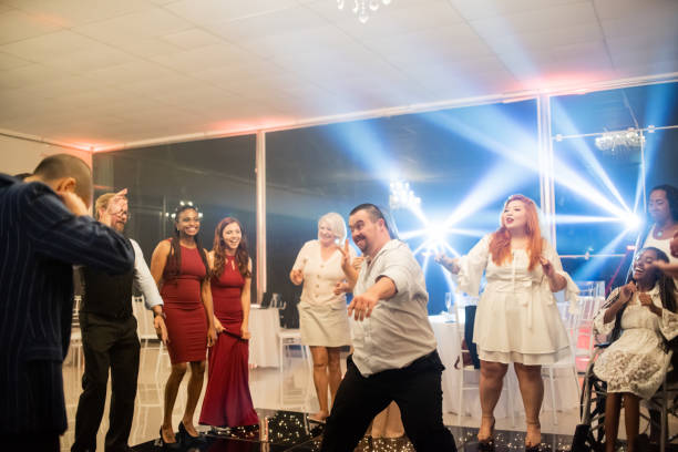 istock Man with down syndrome dancing at the party 1346995555