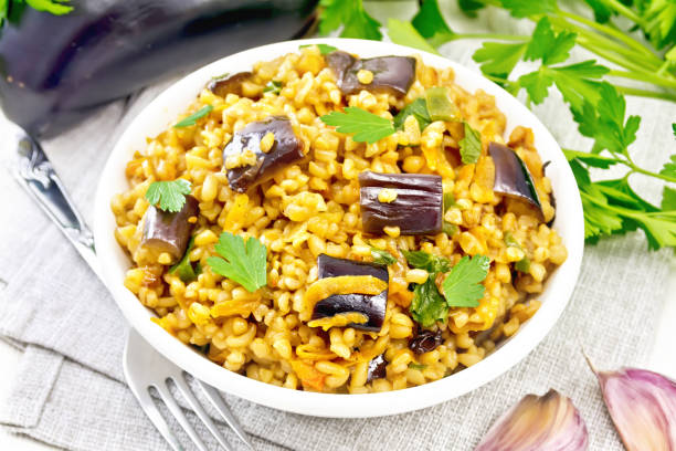 istock Bulgur with eggplant in bowl on board 1346996687