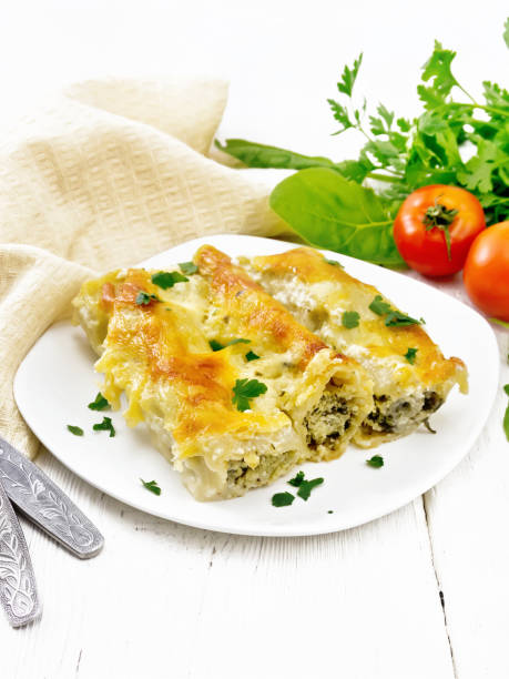 istock Cannelloni with curd and spinach in plate on wooden board 1346998058