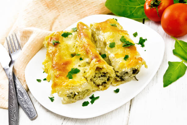 istock Cannelloni with curd and spinach in plate on white board 1346998059