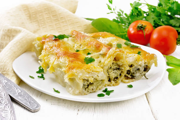 istock Cannelloni with curd and spinach in plate on board 1346998060