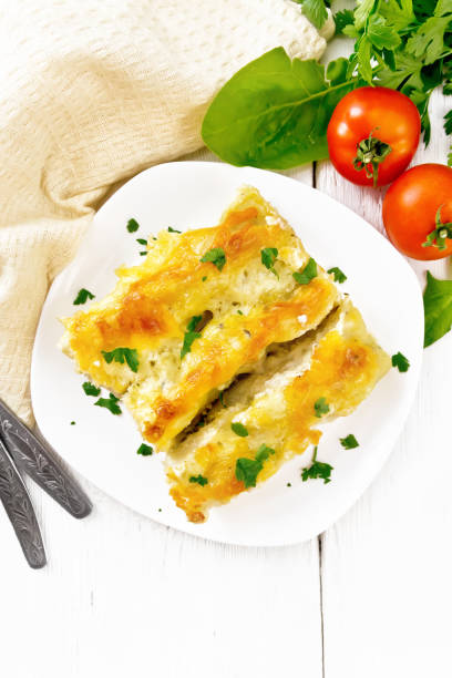 istock Cannelloni with curd and spinach in plate on board top 1346998064