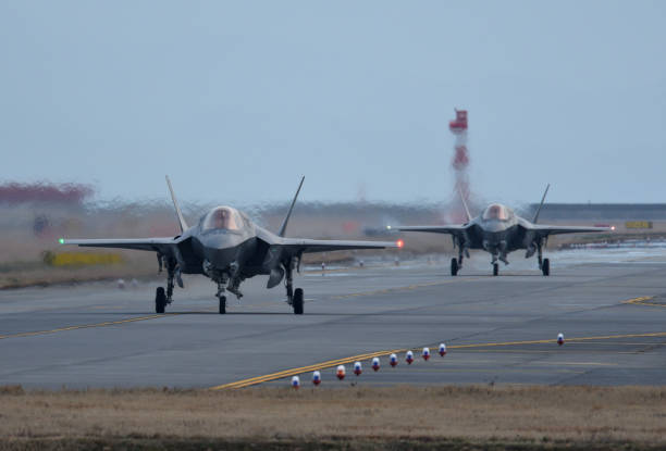 United States Marine Corps Lockheed Martin F-35B Lightning II stealth multirole fighter from VMFA-121 "Green Knights". Yamaguchi, Japan - March 23, 2017:United States Marine Corps (USMC) Lockheed Martin F-35B Lightning II STOVL (short take-off and vertical-landing) stealth multirole fighter belonging to the VMFA-121 "Green Knights" taxiing at the MCAS Iwakuni. military base stock pictures, royalty-free photos & images