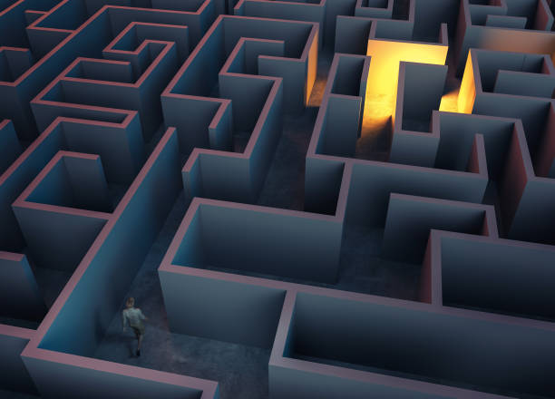 istock Man walking in a labyrinth . Patience and achieving success concept . 1347001078