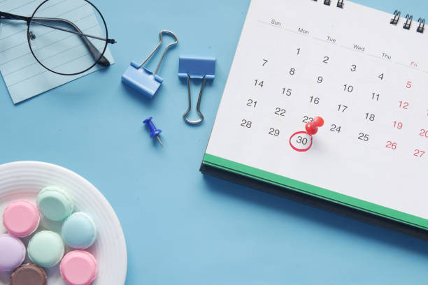 istock deadline concept with push pin on calendar date top view 1347002190