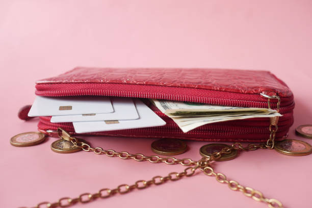 istock us dollar and credit cards in leather on pink background 1347002214