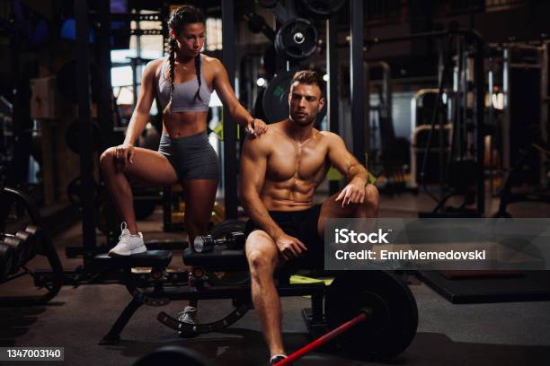 Young Sporty Fit Caucasian Couple Posing At The Gym Stock Photo - Download Image Now