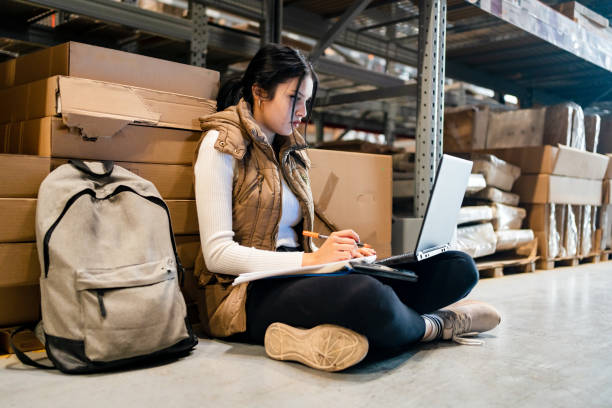 student taking study break at work - night school imagens e fotografias de stock