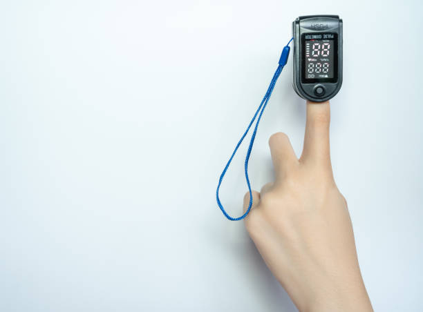 istock Close up of human finger while using Pulse Oximetry isolated on white background. 1347011359