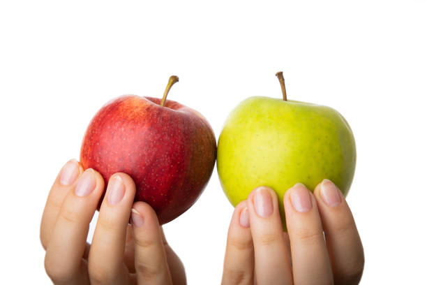 istock Differentiation, selection and comparison of red and green apples. 1347013458