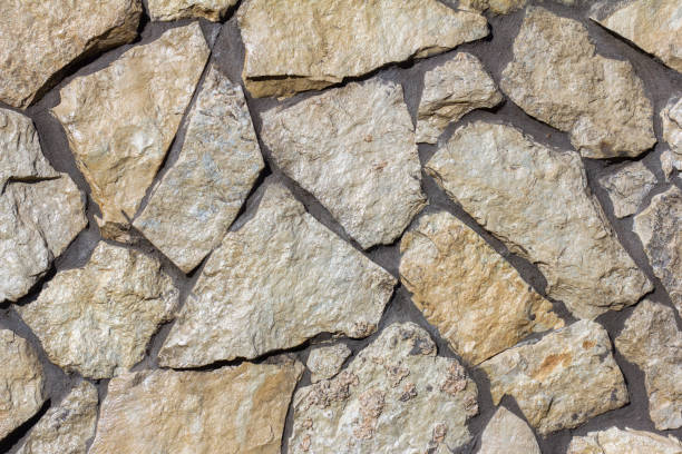 istock The texture of a stone wall. A stone wall as a background or texture. 1347014870