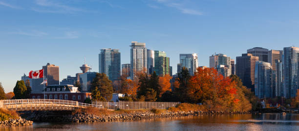istock Panorama of Downtown Vancouver Canada Coal Harbor business district with a large Canada flag 1347014945