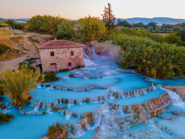 natural spa with waterfalls and hot springs at Saturnia thermal baths, Grosseto, Tuscany, Italy,Hot springs Cascate del Mulino with old watermill, Saturnia, Grosseto, Tuscany, Italy stock photo