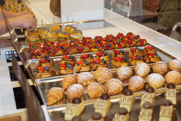 istock Fruit Pastries with Strawberries and Black Cherries and Savory Sandwiches with Cold Cuts 1347019224