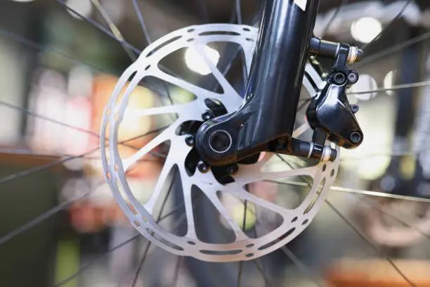 Photo of Mountain bike front wheel with mechanical disc brake closeup
