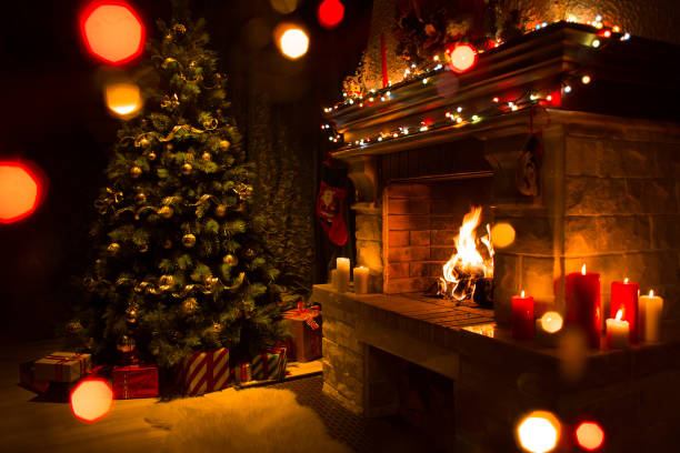 istock Atmospheric christmas card with tree, presents and fireplace 1347021434