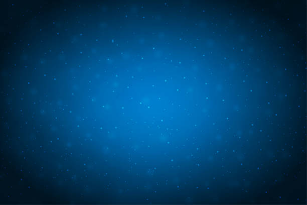 Creative dark midnight blue coloured shiny vector backgrounds with glow in the centre and glittering glowing dots all over A navy blue coloured horizontal vector illustration of a christmas background with shiny dots all over. Apt for Valentine's Day, Christmas, New Year Day theme backgrounds, Xmas greeting card cards, posters, gift wrapping paper and backdrops, space or galaxy or cosmos universe related backdrops with twinkling stars all over. There is no people and ample copy space for text. dark blue stock illustrations
