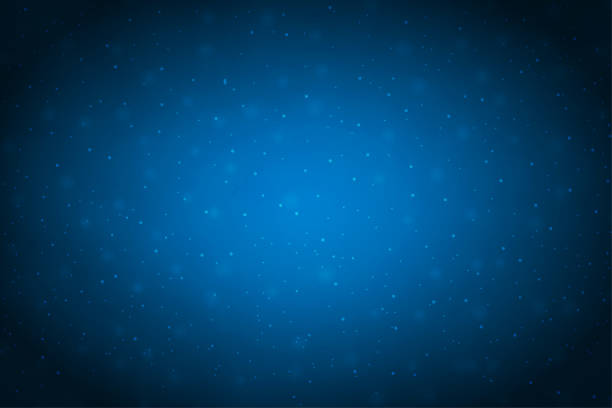 Creative dark midnight blue coloured shiny vector backgrounds with glow in the centre and glittering glowing dots all over A navy blue coloured horizontal vector illustration of a christmas background with shiny dots all over. Apt for Valentine's Day, Christmas, New Year Day theme backgrounds, Xmas greeting card cards, posters, gift wrapping paper and backdrops, space or galaxy or cosmos universe related backdrops with twinkling stars all over. There is no people and ample copy space for text. dark blue night stock illustrations