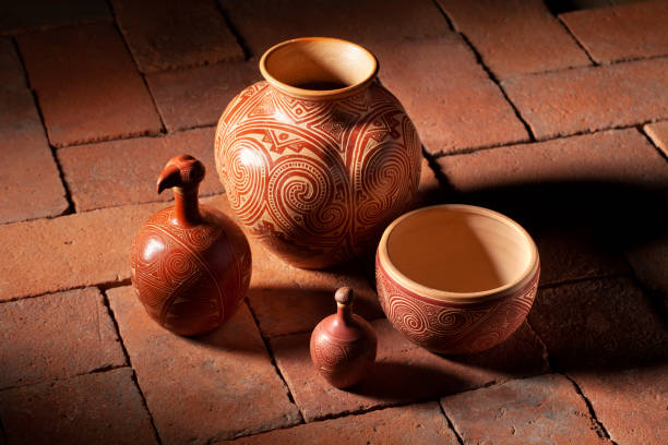 A large stack of multi-colored pottery.