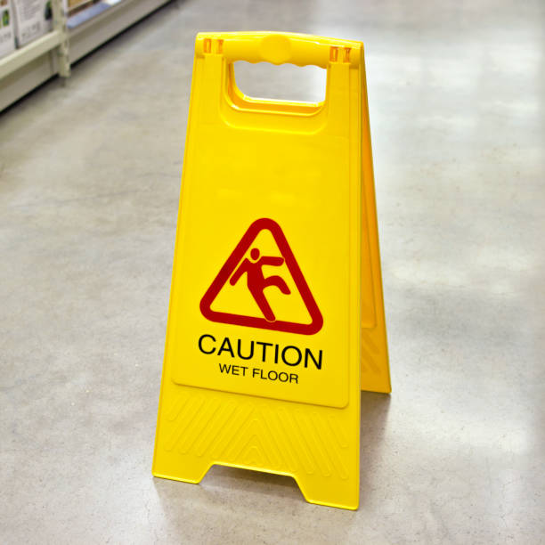 istock Yellow sign that alerts for wet floor. 1347027451