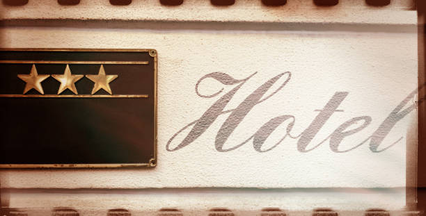 istock Beautiful HOTEL calligraphy sign next to three stars facade 1347028491