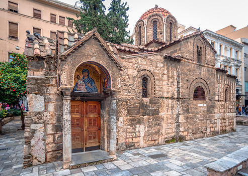 Athens, Greece - December 31 2013: The Church of Panagia Kapnikarea is one of the oldest orthodox churches in Athens, located in the center of the modern city, right in the middle of Ermou st, in Monastiraki.