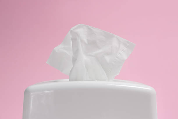 istock Holder with paper tissues on pink background, closeup 1347029157