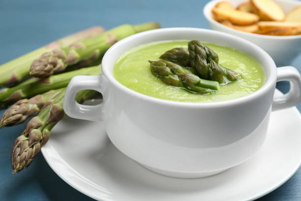 istock Delicious asparagus soup served on blue table 1347030399