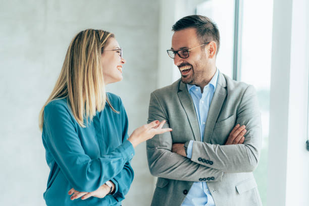 istock Two cheerful business people 1347032237