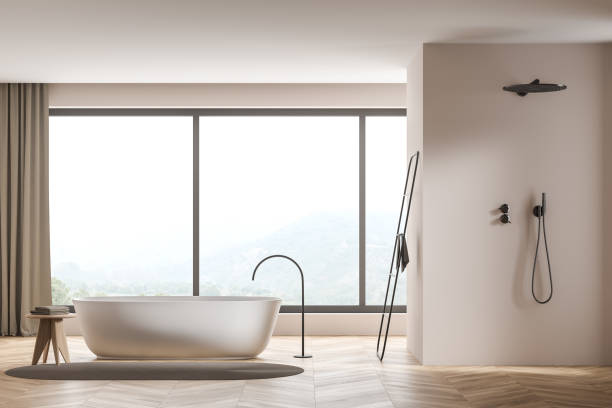 istock Beige panoramic bathroom with oval white ceramic bathtub and shower cabin 1347032281