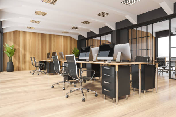 istock Black-and-white office space with sliding doors and wooden materials. Corner view. 1347032426