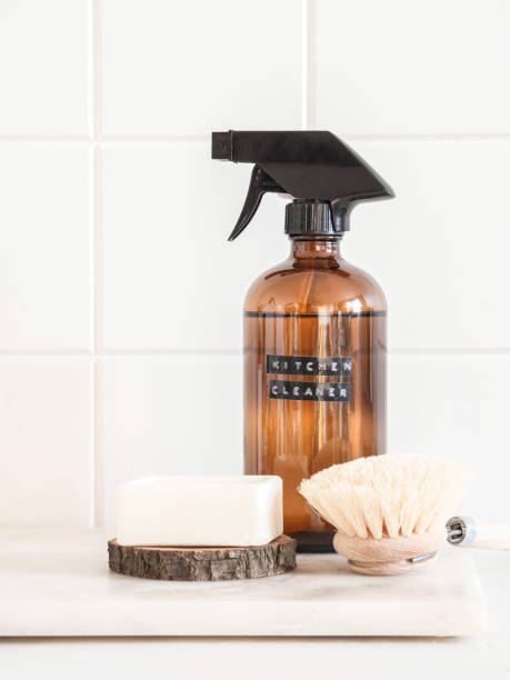 istock Amber bottle with washing solution, brush and soap on a marble shelf 1347032576