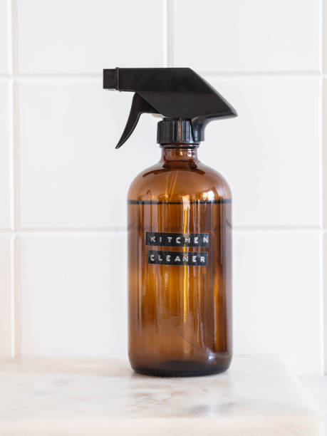 istock Amber bottle with washing solution on a marble shelf. Zero waste home cleaning concept. 1347032608