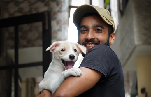 a dog lover young boy with his dog happy and smiling