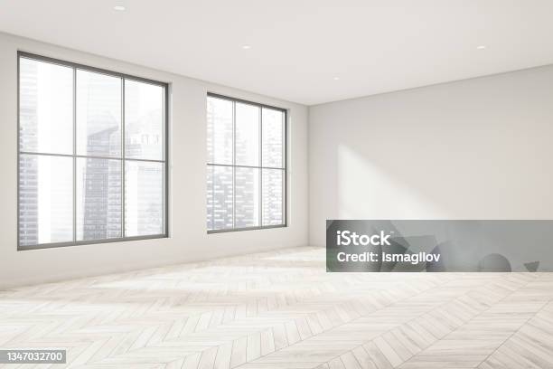 Empty White Room With Light Wood Floor And Windows Corner View Stock Photo - Download Image Now