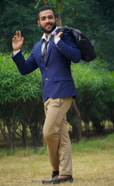 istock a young business man saying hi image -business concept 1347033235